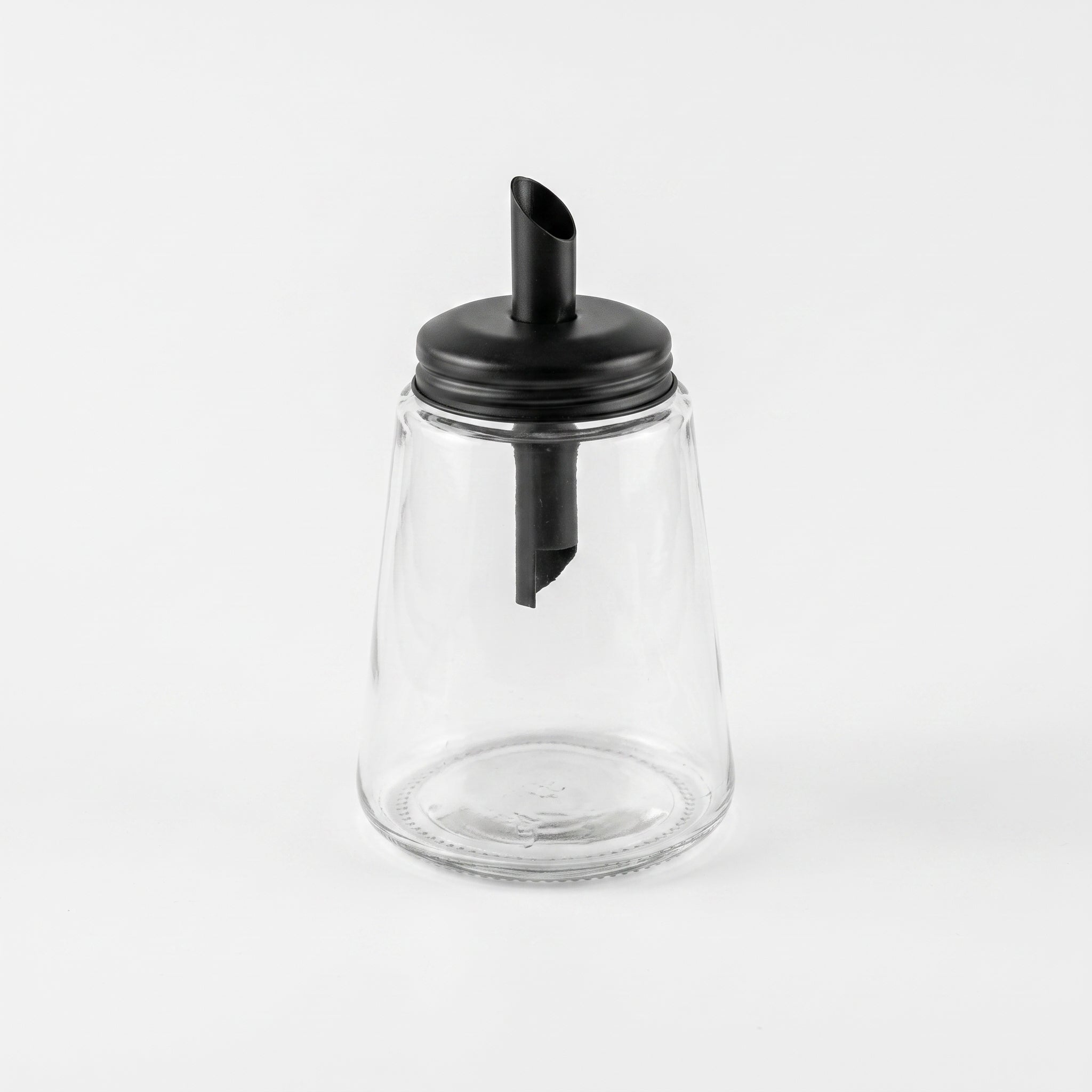 Black-lidded glass sugar bowl