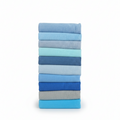 Stack of folded blue and gray fabric swatches on a white background